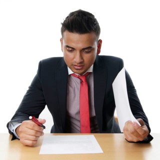 Man reads contract at his desk