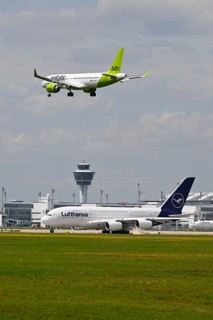 Lufthansa Airbus A380-800 with control tower waiting for take-off clearance for southern runway