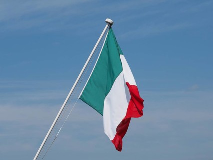 Italian Flag of Italy over blue sky