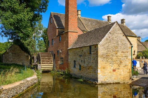 Old water mill in Lower Slaughter, a village in Cotswolds area, England, UK