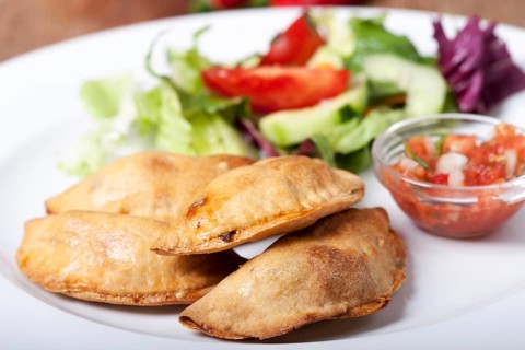 Homemade empanadas with salsa
