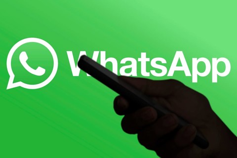 WhatsApp logo is displayed on smartphone.