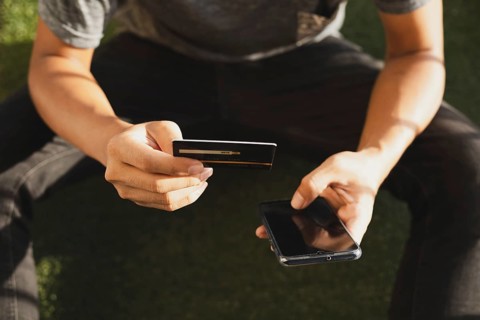 A man online shopping using credit card and Mobile phone for online shopping, technology and