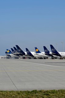 Various Lufthansa aircraft at check-in position in front of satellite, Terminal 2, Munich Airport,