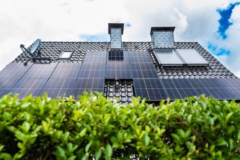 Solar panels and solar thermal energy on the roof of a detached house in Essen, Germany, Europe