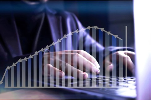 Business data analysis. Hands of an unrecognizable businessman analyzing statistics on his computer