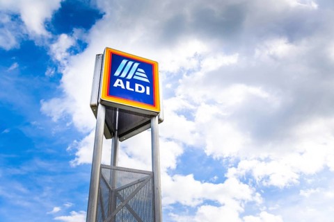 Hockenheim, Germany - June 08, 2022: Commercial sign of ALDI Store against a blue sky. ALDI is a
