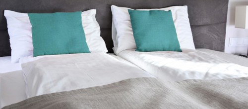 Double bed in hotel room. Accommodation