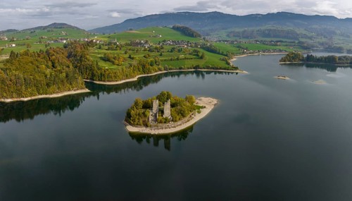 Islands in the reservoir, Ile d'Ogoz with castle ruins and Chapelle Saint Théodule, Lac de Gruyère,