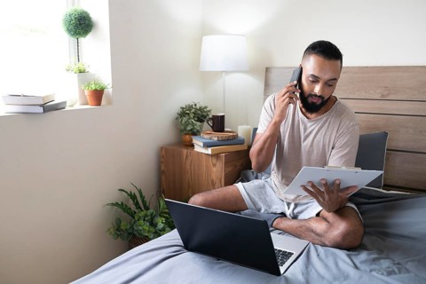 Full shot man working bed