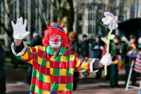 Waving clown on the roadside at the 2011 carnival in Düsseldorf