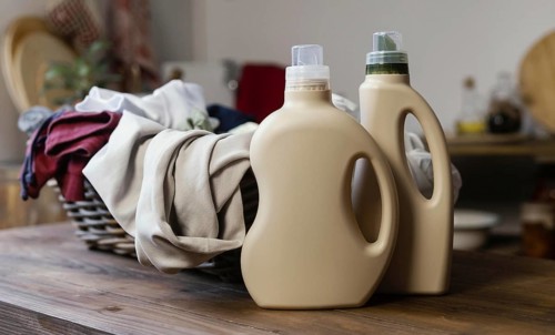 Detergent bottles clothes arrangement. High resolution photo