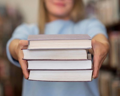 Close up woman holding books