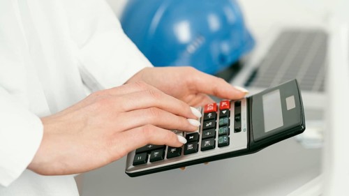Close up hands holding calculator