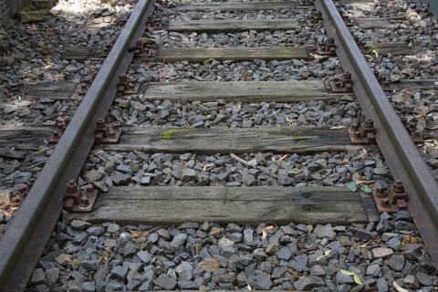 Rails with old wooden sleepers as part of the Gleis 17 memorial site, former Grunewald goods