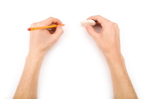 Left-handed person with pencil and eraser