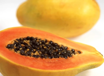 PAW PAW OR PAPAYA (carica papaya) FRUIT AGAINST WHITE BACKGROUND