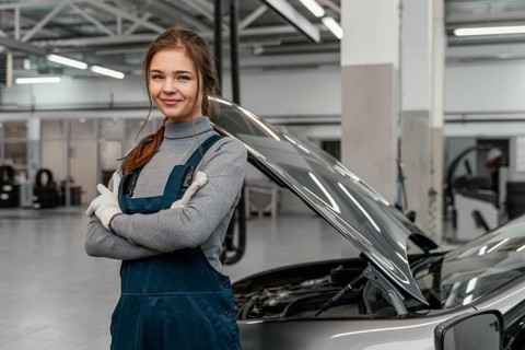 Young woman working car service