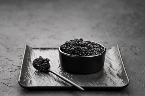 High angle bowl with black caviar. High resolution photo