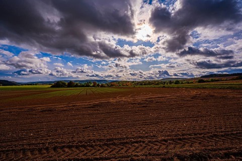View over the fields of Dornburg towards Jena in autumn with thick rain clouds, Dornburg,