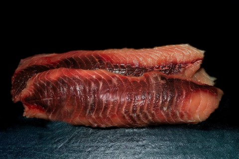 Trimmed fillets of grass carp (Ctenopharyngodon idella), also known as white Amur, wild catch from