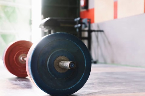 Bodybuilding concept with barbell gym