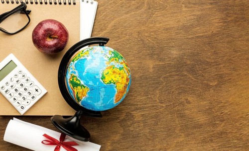 Top view globe with diploma copy space
