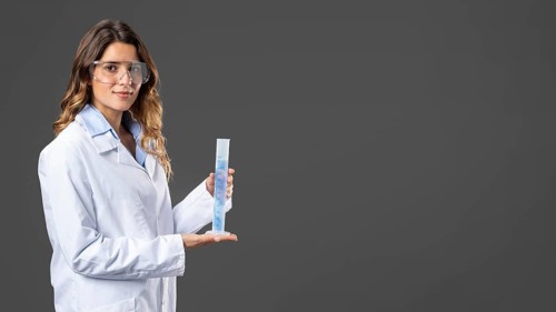 Portrait female doctor using hand sanitizer