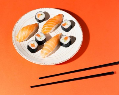 Plate with delicious variety sushi chopsticks