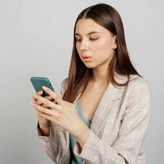 Portrait stylish woman using mobile
