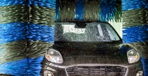 A vehicle in an automatic car wash