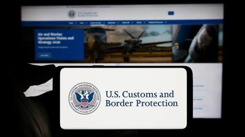 Stuttgart, Germany, 10-29-2023: Person holding mobile phone with seal of agency United States