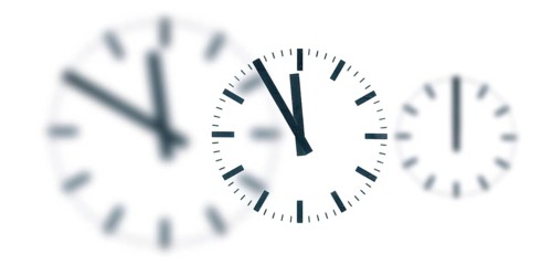 A simple clock or dial, the hands indicating five to twelve and indicating it is high time