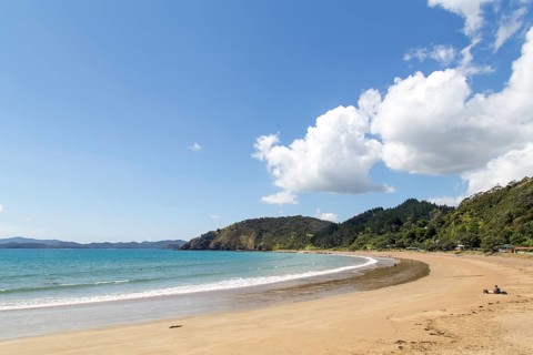 Russell, New Zealand, February 18, 2015: A sandy beach called Long beach close at Oneroa Bay,