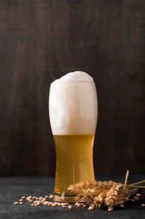 Glass blonde beer with foam