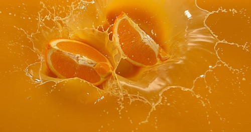 Orange (citrus sinensis), Fruit falling into Orange Juice