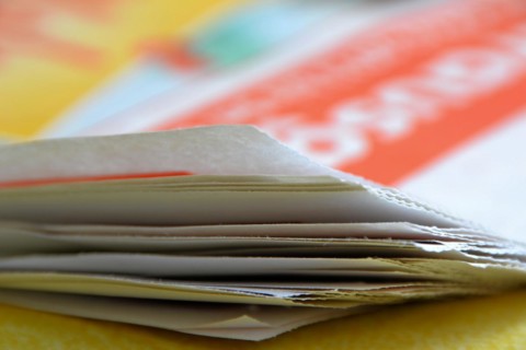 A newspaper lies on a table