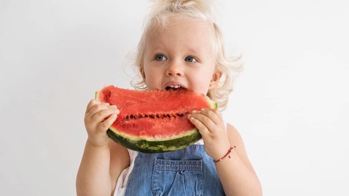 Adorable baby playing with food 2