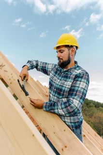 Worker building roof house