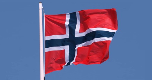Norwegian Flag Waving in the Wind against blue sky