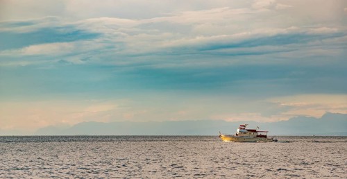 A picture of a fishing boat in the Adriatic Sea waters near Piran