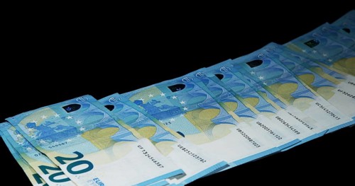 Euros Money Falling against Black Background