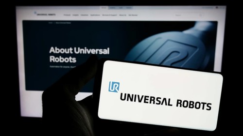 Stuttgart, Germany, 02-12-2024: Person holding smartphone with logo of Danish cobot company