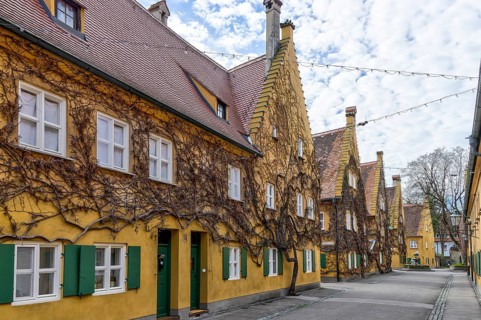 Building in the historic Fuggerei residential complex in the old town of Augsburg, Augsburg,