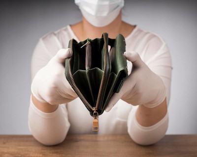 Woman with medical mask holding empty wallet