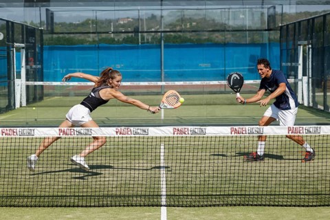 Young couple playing padel at the Club Robinson in Ugento, Apulia, Italy, Europe