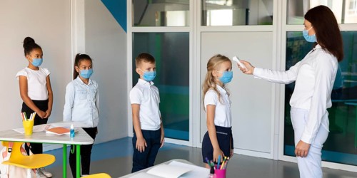 Side view kids waiting line temperature measurements