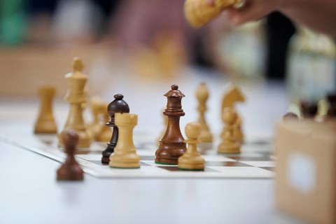 Chess pieces in focus with blurred background on a game board