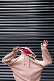 Medium shot teen with pink hoodie