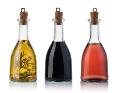 Bottle of olive oil and vinegar isolated on white background